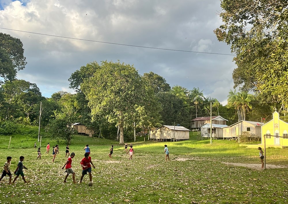 Children from a local community near Lake Tefé, play football.